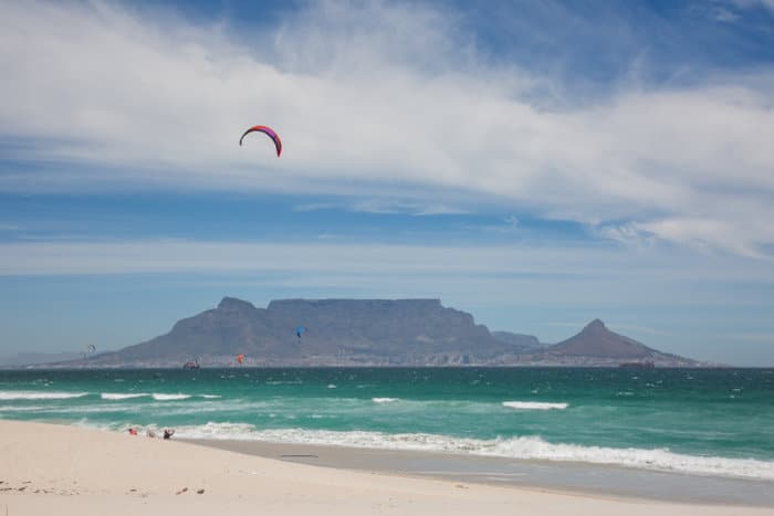 View of Table Mountain from Blouberg Beach, with kitesurfers