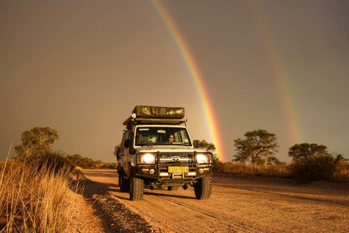 Land Cruiser with rainbow in the background - self-drive safari in Upington, South Africa